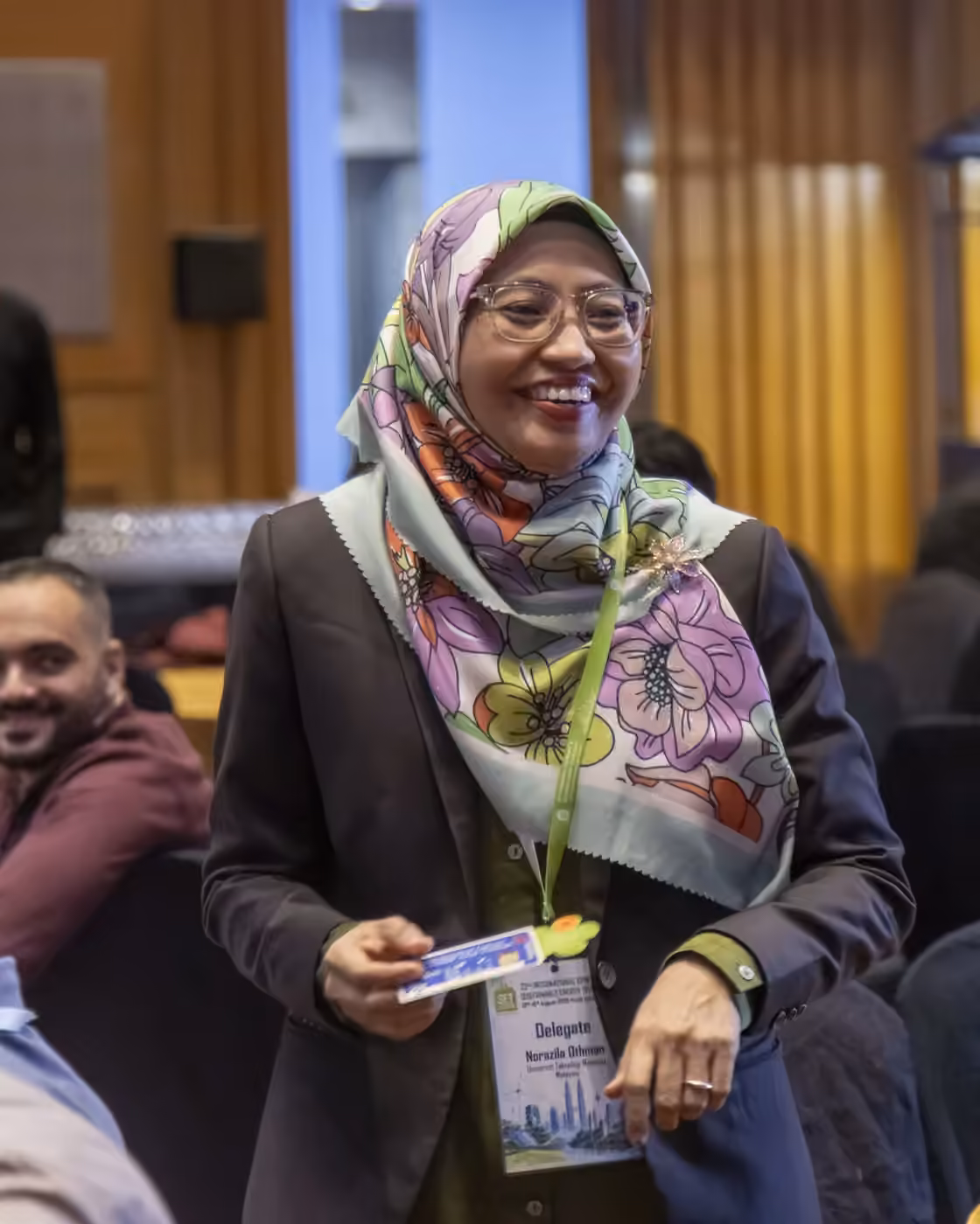 A delegate standing among the tables at the SET Conference